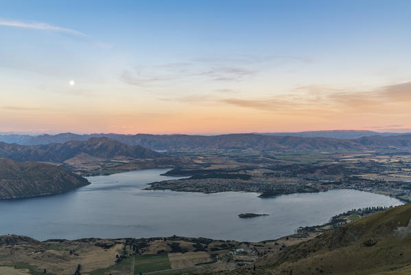Moonlight over Lake Wanaka at sunset. Wanaka, Queenstown Lakes district, Otago region, South Island, New Zealand.