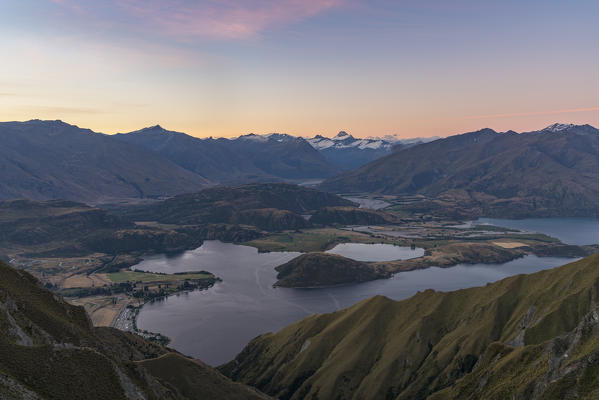View of Glendhu Bay and Mt aspiring NP from Roys Peak lookout at sunset. Wanaka, Queenstown Lakes district, Otago region, South Island, New Zealand.