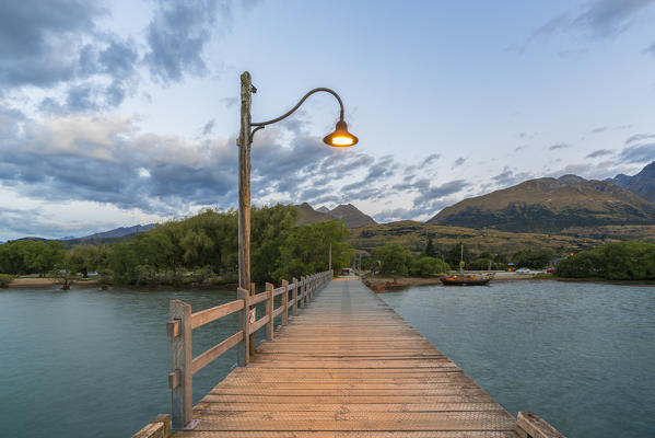 The jetty with lamp post at dusk. Glenorchy, Queenstown Lake district, Otago region, South Island, New Zealand.