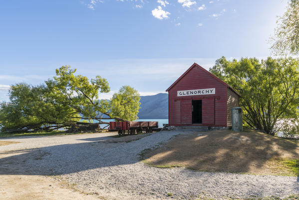 The red boat house in Glenorchy in summer. Queenstown Lakes district, Otago region, South Island, New Zealand.
