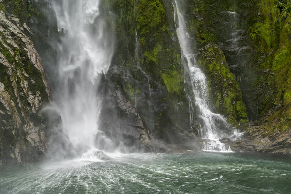 Stirling Falls reaching the sea in Milford Sound. Fiordland NP, Southland district, Southland region, South Island, New Zealand.