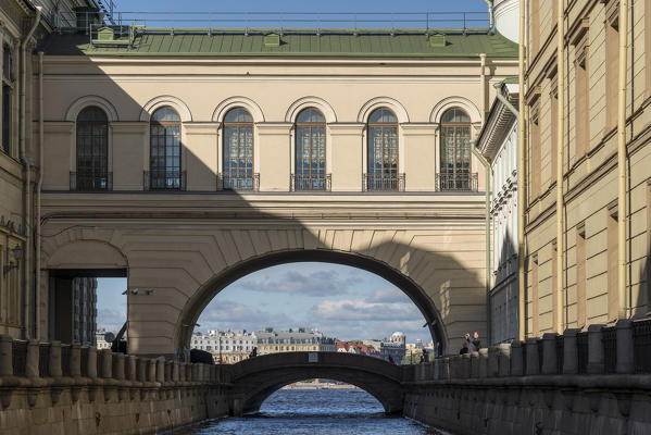 Arch and Hermitage Bridge over Winter Canal, connecting Old Hermitage and Hermitage Theater. Saint Petersburg, Russia.