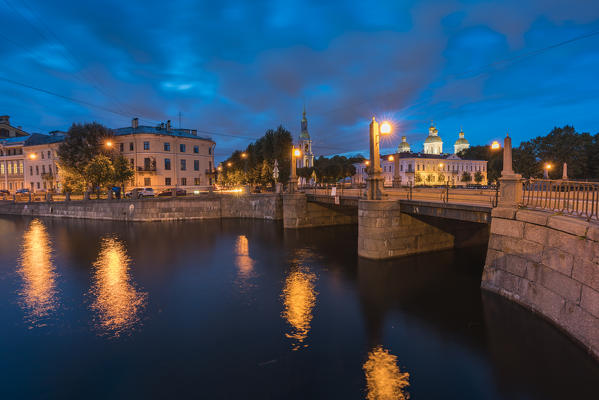 Krasnogvardeysky Bridge over Griboyedov Canal and St Nicholas Cathedral at dusk. Saint Petersburg, Russia.