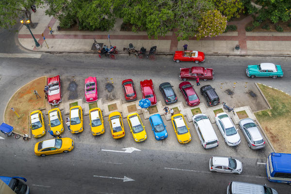 Classic cars and taxis in Parque Central, Old Havana, Havana, Havana Province, Cuba