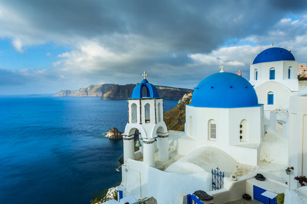 Typical buildings and churches in Oia, Santorini, Cyclades Islands, Greece