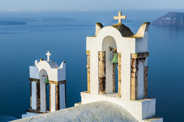 Panoramic view from the tiny roads of Oia in the North West of Santorini, Cyclades, Greece
