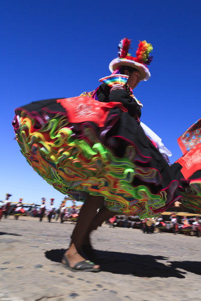 People wearing traditional costumes on Isla Taquile on the Peruvian side of Lake Titicaca, Peru, South America