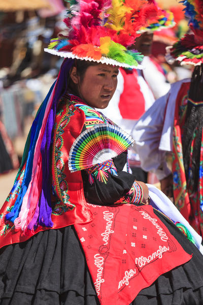 People wearing traditional costumes on Isla Taquile on the Peruvian side of Lake Titicaca, Peru, South America