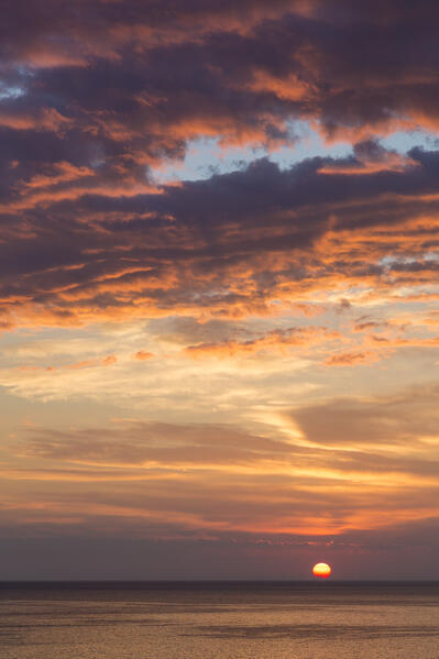 Partly cloudy sunrise near Cala San Felice Bay in Vieste, Gargano, Foggia district, Apulia, Italy