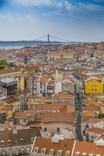 Lisbon, Portugal. The old quarter of Alfama and view on the Ponte do 25 Abril bridge