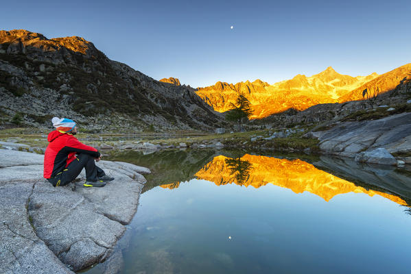 admiring the Rhaetian Alps at sunrise
Europe, Italy, Trentino Alto Adige, Madonna di Campiglio, Nambrone valley, Trento district