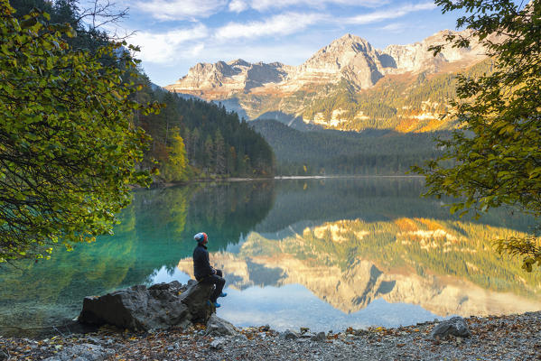 tourist admiring the landscape of Natural Park Adamello Brenta
Europe, Italy, Trentino, Non valley, Ville d'Anaunia municipality, Trento province