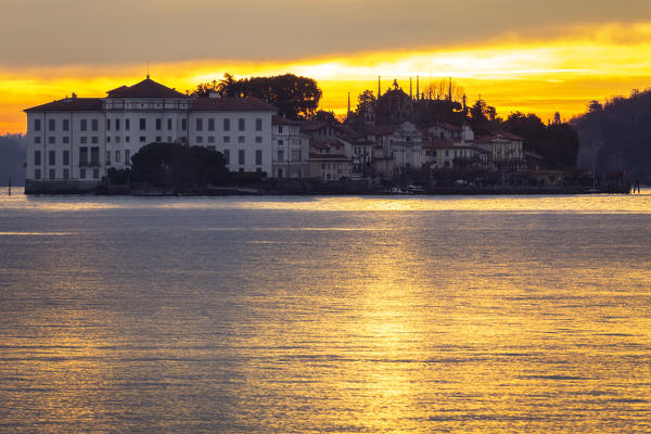 View of Isola Bella from the shore of Baveno in a winter sunrise, Piedmont, Italy.