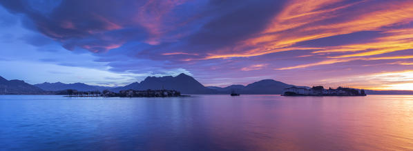 View of the Borromean Islands, Isola dei Pescatori and Isola Bella, from the shore of Baveno in a winter sunrise, Verbano Cusio Ossola, Lago Maggiore, Piedmont, Italy.