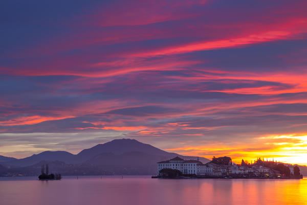 View of Isola Bella from the shore of Baveno in a winter sunrise, Piedmont, Italy.