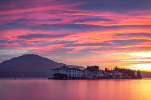 View of Isola Bella from the shore of Baveno in a winter sunrise, Piedmont, Italy.