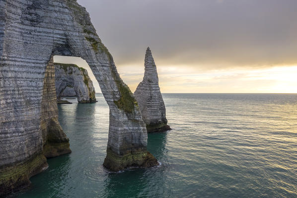 Aerial view of a sunset in front of the cliffs of Etretat, Octeville sur Mer, Le Havre, Seine Maritime, Normandy, France, Western Europe.