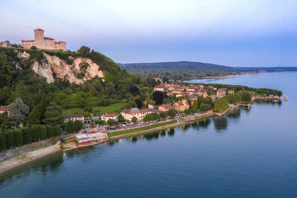 View of the fortress called Rocca di Angera during a spring sunset. Angera, Lake Maggiore, Varese district, Lombardy, Italy.