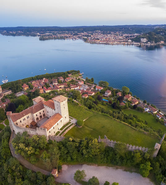 View of the fortress called Rocca di Angera during a spring sunset. Angera, Lake Maggiore, Varese district, Lombardy, Italy.
