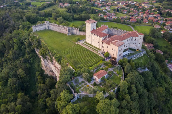 View of the fortress called Rocca di Angera during a spring sunset. Angera, Lake Maggiore, Varese district, Lombardy, Italy.