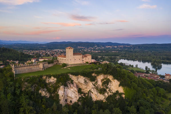 View of the fortress called Rocca di Angera during a spring sunset. Angera, Lake Maggiore, Varese district, Lombardy, Italy.