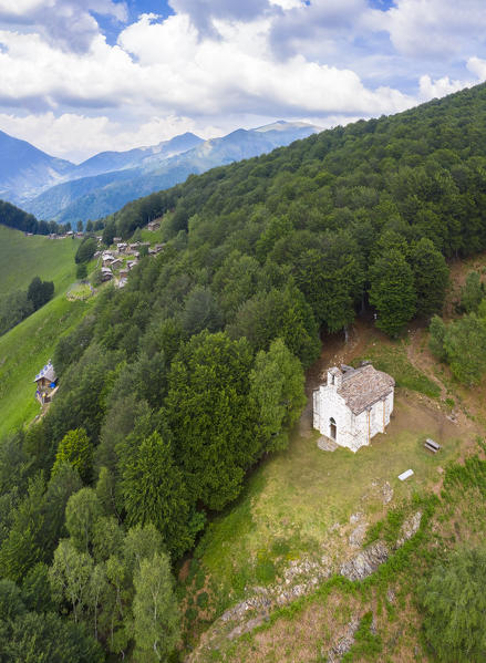 Aerial view of the pastures of Alpone di Curiglia and the church of Madonna della Guardia. Curiglia con Monteviasco, Veddasca valley, Varese district, Lombardy, Italy.