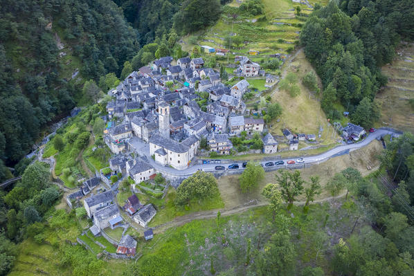 View of the town of Corippo, the town with less inhabitants of all Switzerland, and Lake Vogorno with Verzasca Dam. Corippo, Valle Verzasca, Canton Ticino, Switzerland.