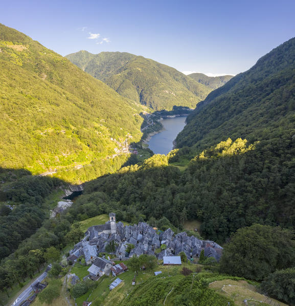 View of the town of Corippo, the town with less inhabitants of all Switzerland, and Lake Vogorno with Verzasca Dam. Corippo, Valle Verzasca, Canton Ticino, Switzerland.