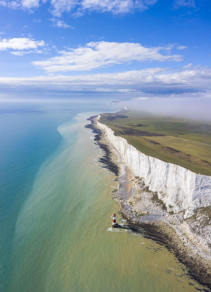 Aerial view of Beachy Head with it's Lighthouse, a chalk headland in East Sussex, England. It is situated close to Eastbourne, immediately east of the Seven Sisters. Southern England.