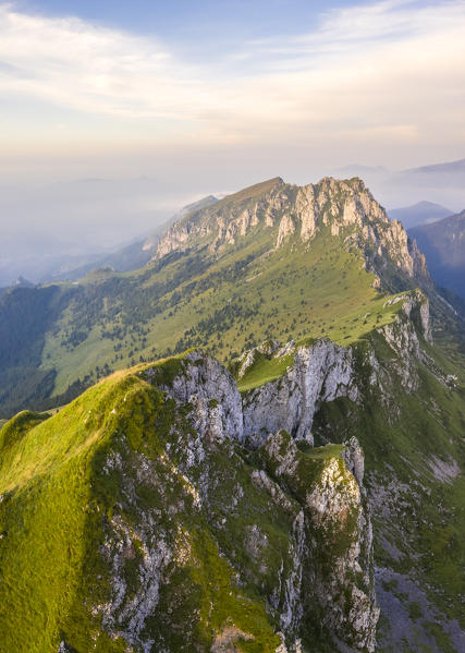 Aerial view of Pizzo Olone and Cima di Bares at dawn at the foothills of Pizzo della Presolana. Castione della Presolana, Bergamo province, upper Val Seriana, Lombardy, Italy.