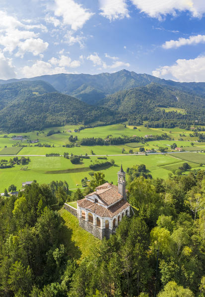 Aerial view of the fields surrounding the small church of Chiesa della Santissima Trinità in Clusone city. Val Seriana, Bergamo district, Lombardy, Italy.