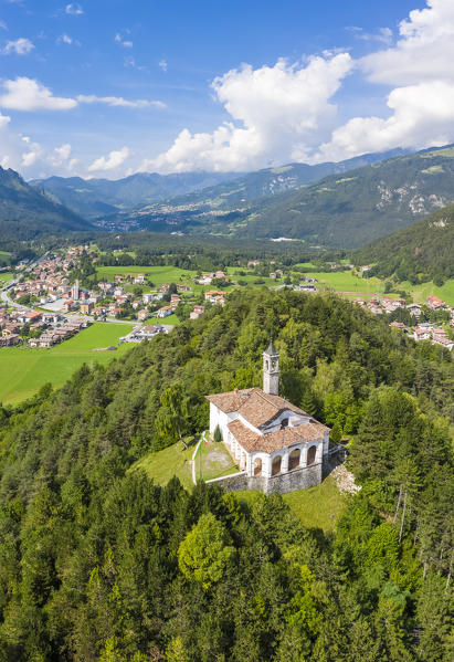 Aerial view of the fields surrounding the small church of Chiesa della Santissima Trinità in Clusone city. Val Seriana, Bergamo district, Lombardy, Italy.