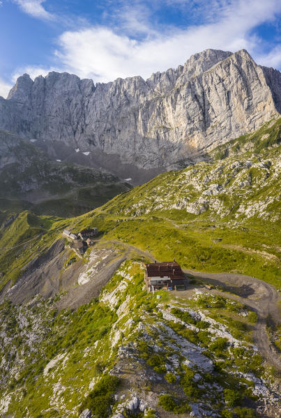 Aerial view of the Albani refuge and the north face of the Presolana at dawn. Val di Scalve, Bergamo district, Lombardy, Italy, Southern Europe.