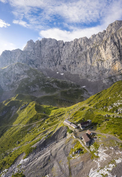 Aerial view of the old huts of the miners and the north face of the Presolana at dawn. Val di Scalve, Bergamo district, Lombardy, Italy, Southern Europe.