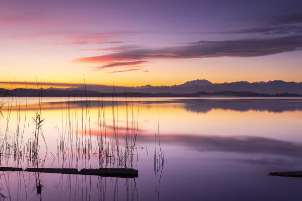 Monte Rosa reflecting on Lake Varese during a winter sunset at Calcinate del Pesce, Varese Province, Lombardy, Italy.