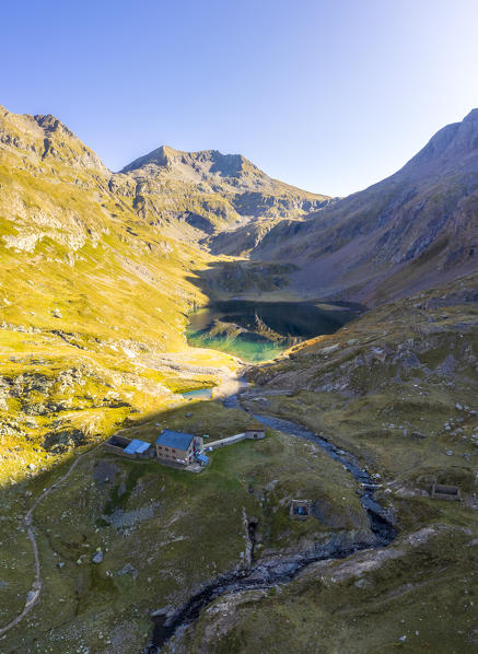Aerial view of the natural lake of Barbellino and it's refuge. Valbondione, Seriana Valley, Lombardy, Bergamo province, Italy.