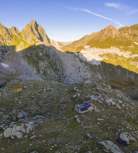 Aerial view at sunrise of the Pizzo Prevat and Capanna Leit. Rodi, Prato Leventina, Valle Leventina, Canton Ticino, Switzerland.