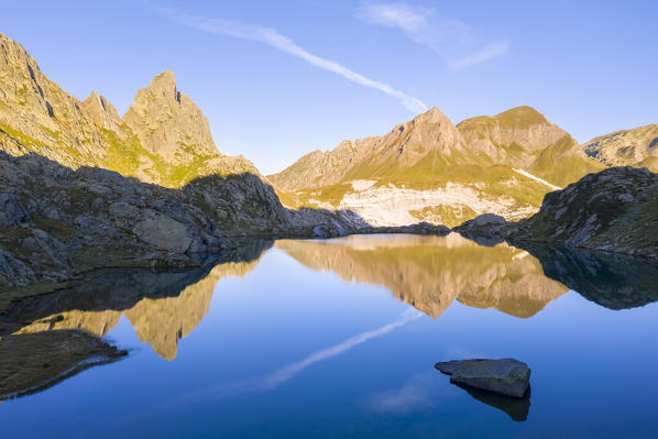 Aerial view at sunrise of the Pizzo Prevat reflected on Lago Leit. Rodi, Prato Leventina, Valle Leventina, Canton Ticino, Switzerland.