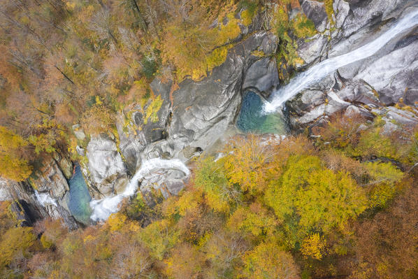 Aerial view of the waterfall of the river Valegg da Cansgell in autumn, near the town of Lavertezzo. Valle Verzasca, Canton Ticino, Switzerland.
