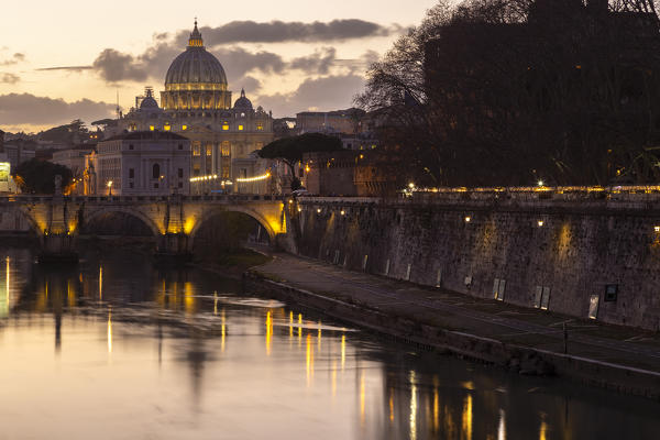 Sunset in Rome in front of the Basilica di San Pietro, Sant'Angelo bridge and the river Tevere from Umberto I bridge. Rome, Rome district, Lazio, Europe, Italy.