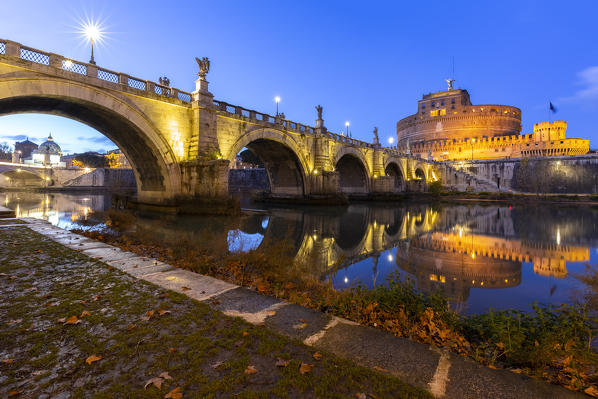 Blue hour in Rome in front of the Sant'Angelo bridge, the Tevere river and Castel Sant'Angelo. Rome, Rome district, Lazio, Europe, Italy.