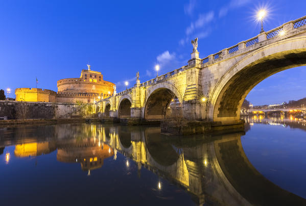 Blue hour in Rome in front of the Sant'Angelo bridge, the Tevere river and Castel Sant'Angelo. Rome, Rome district, Lazio, Europe, Italy.