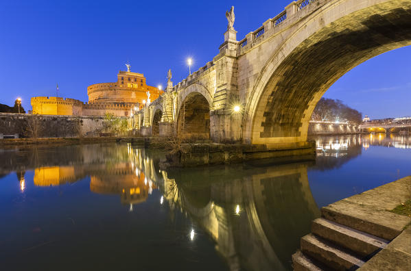 Blue hour in Rome in front of the Sant'Angelo bridge, the Tevere river and Castel Sant'Angelo. Rome, Rome district, Lazio, Europe, Italy.