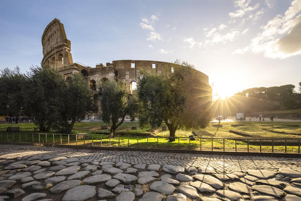 View of the Colosseum during a winter sunrise from the Via Sacra. Rome, Lazio, Italy. 