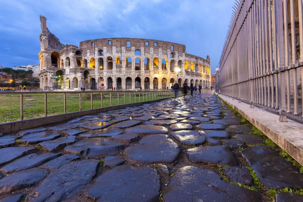 View of the Colosseum during a winter evening from the Via Sacra. Rome, Lazio, Italy. 
