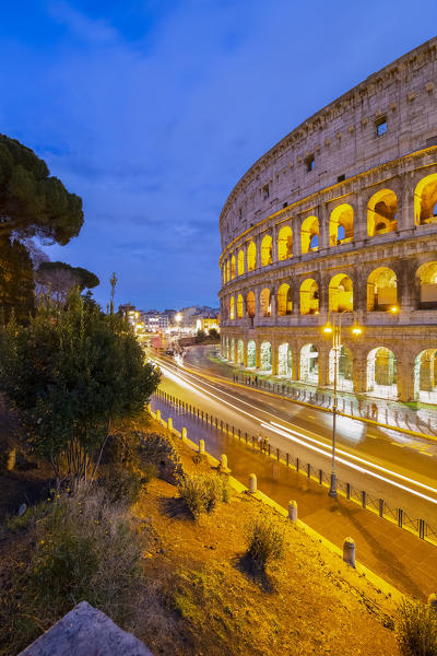 Car trails going towards the Colosseum during a winter evening. Rome, Lazio, Italy. 