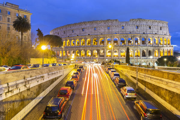 Car trails going towards the Colosseum during a winter evening. Rome, Lazio, Italy. 