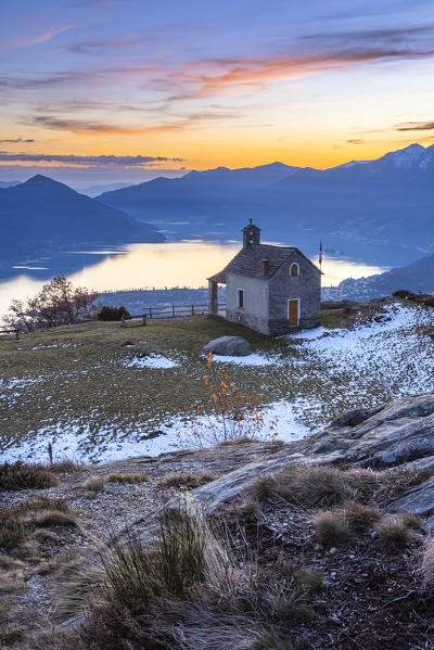 View of the stone church of Monti di Lego, overlooking Lago Maggiore, Ascona and Locarno. Mergoscia, Valle Verzasca, Canton Ticino, Switzerland.