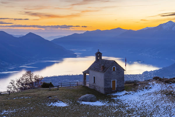 View of the stone church of Monti di Lego, overlooking Lago Maggiore, Ascona and Locarno. Mergoscia, Valle Verzasca, Canton Ticino, Switzerland.