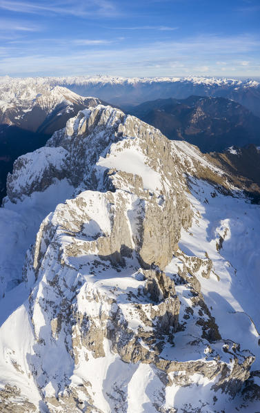 Aerial panorama of the Presolana mountain from above, covered in snow in winter. Val di Scalve, Bergamo district, Lombardy, Italy, Southern Europe.